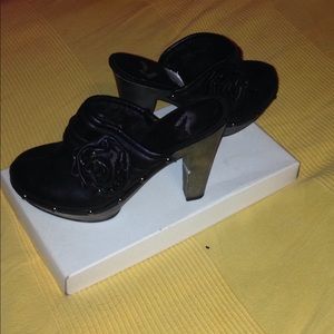 Report black heeled mules